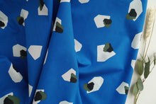 Load image into Gallery viewer, Fabric slightly scrunched up shows drape of Marlie-Lawn Cotton Fabric, with print of gemstones.