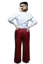 Load image into Gallery viewer, Back view of standing lady wearing red wide legged trousers showing welt pocket detail at hip level. Narrow roll up hems.