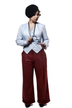 Load image into Gallery viewer, Front view of standing lady, wearing red, wide legged trousers showing crease folds along centre of legs. Narrow roll up hems.
