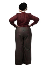 Load image into Gallery viewer, Back view of lady in check pattern wide-leg Madrid trousers.