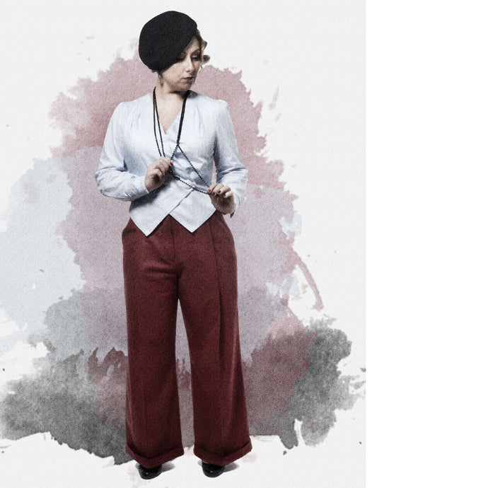 Illustration effect of lady wearing a white jacket with wide legged red trousers.