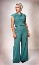 Load image into Gallery viewer, Full length view of lady wearing green Vanlose trouser suit.