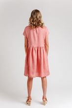 Load image into Gallery viewer, Back view of lady wearing a knee-length dress, with short sleeves, gathered seam at the waist