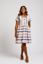 Load image into Gallery viewer, Lady wears Olive V-neck insert, knee-length dress in a stripe pattern fabric