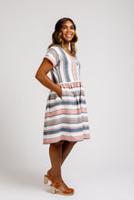 Load image into Gallery viewer, Lady wears Olive dress in stripe pattern fabric with hands in pocket