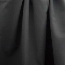 Load image into Gallery viewer, Organic Candy Cotton Fabric hangs displaying soft handle