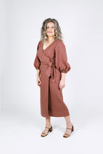 Load image into Gallery viewer, Side view of lady wearing Aura wrap dress with balloon sleeves and waist tie