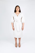 Load image into Gallery viewer, Front view of lady wearing Aura wrap dress with balloon sleeves and waist tie