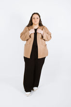 Load image into Gallery viewer, Lady wears Juno Jacket untied, holding onto front neck band