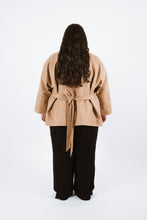 Load image into Gallery viewer, Back view shows lady wearing Juno Jacket with waist tie loosely tied at back