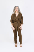 Load image into Gallery viewer, Lady wears Juno Jacket tied at waist, showing off Palisade pockets on either side of front band