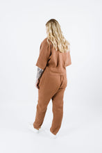Load image into Gallery viewer, Back view of lady wearing variation one of the Pinnacle Top. Plain back, with elbow length sleeves.