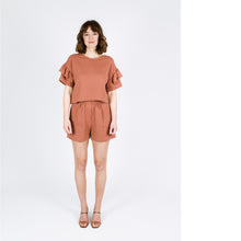 Load image into Gallery viewer, Lady wears Solar Tee with ruffles on sleeves