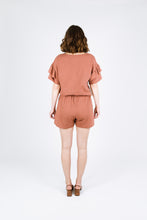 Load image into Gallery viewer, Back view of lady wearing Solar Tee with ruffles on sleeves