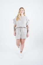 Load image into Gallery viewer, Lady wears Solar Tee with ruffles on sleeves