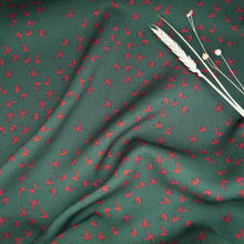 Load image into Gallery viewer, EcoVero Viscose Fabric slightly crumpled, displayed with dried flower stems on top
