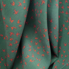 Load image into Gallery viewer, EcoVero Viscose Fabric hangs, displaying a soft handle