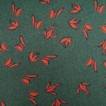Load image into Gallery viewer, Close up of EcoVero Viscose Fabric with print of small fluttering leaves