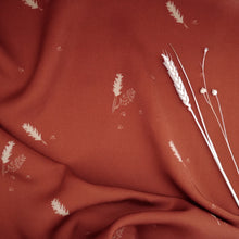 Load image into Gallery viewer, EcoVero Viscose fabric slightly crumpled, displayed with dried flower stems