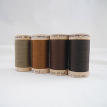Load image into Gallery viewer, Four wooden reels of organic cotton sewing thread in Khaki, Acorn Brown, Mid Brown and Dark Brown colours