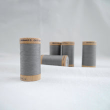 Load image into Gallery viewer, Five wooden reels of Scanfil Organic Cotton Thread in Steel Grey
