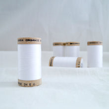 Load image into Gallery viewer, Five wooden reels of Organic Cotton sewing thread in White colour.
