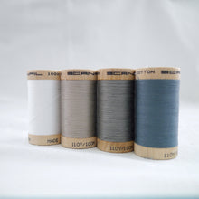 Load image into Gallery viewer, Four wooden reels of Scanfil Organic Cotton Thread in White, Sand, Steel Grey and Stormy Blue colours