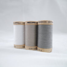 Load image into Gallery viewer, Three wooden reels of Scanfil Organic Cotton Thread in White, Sand and Steel Grey colours.