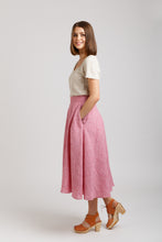 Load image into Gallery viewer, Side view of shin-length Tania Culottes with hand in pocket
