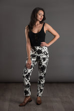 Load image into Gallery viewer, Lady wears a slim leg The City trousers in patterned print, with hand on hip