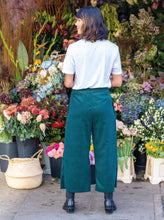 Load image into Gallery viewer, Back view of lady wearing The Culottes in front of a flower stall
