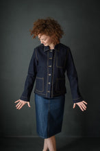 Load image into Gallery viewer, Lady stands wearing knee length pencil denim skirt. Worn with a denim jacket.