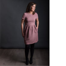 Load image into Gallery viewer, Lady stands wearing a fitted bodice, short sleeve top and gathered waist skirt Day Dress.