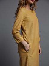 Load image into Gallery viewer, Side view close up shows hand in pocket, below the gathered back waistline, and fluid clear front.