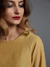 Load image into Gallery viewer, Close up shows front raglan shoulder seam.