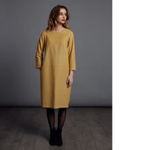 Load image into Gallery viewer, Lady stands wearing yellow long sleeve plain dress, just below knee-length.