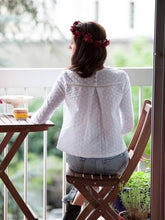 Load image into Gallery viewer, Back view of lady wearing a cotton Broiderie Anglaise top showing three button fastening at neckline holding an inverted pleated down along the centre back.