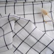 Load image into Gallery viewer, Linen gently folded to show drape with black large box check