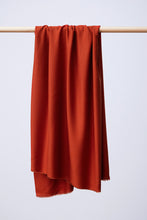 Load image into Gallery viewer, EcoVero Viscose fabric hangs and drapes over a wooden rod