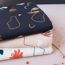 Load image into Gallery viewer, Three pieces of folded fabric in different colours