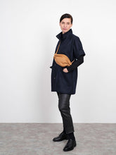 Load image into Gallery viewer, Side view of lady wearing Cap Sleeve Vest with a crossover body bag