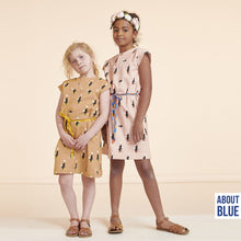 Load image into Gallery viewer, Two young people standing next to one another wear dresses made using Zoo On Wheels French Terry fabric
