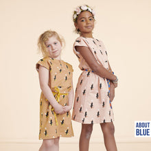 Load image into Gallery viewer, Two young people standing next to one another wear dresses made using Zoo On Wheels French Terry fabric
