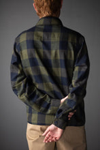 Load image into Gallery viewer, Back view of man wearing the Arbor Short in a check pattern. 
