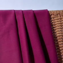 Load image into Gallery viewer, Close up of Cotton Gabardine fabric draped over back of wicker chair
