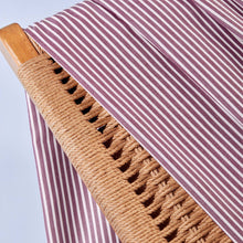 Load image into Gallery viewer, Close up of Stripe Sunray Viscose Modal fabric draped over wicker chair
