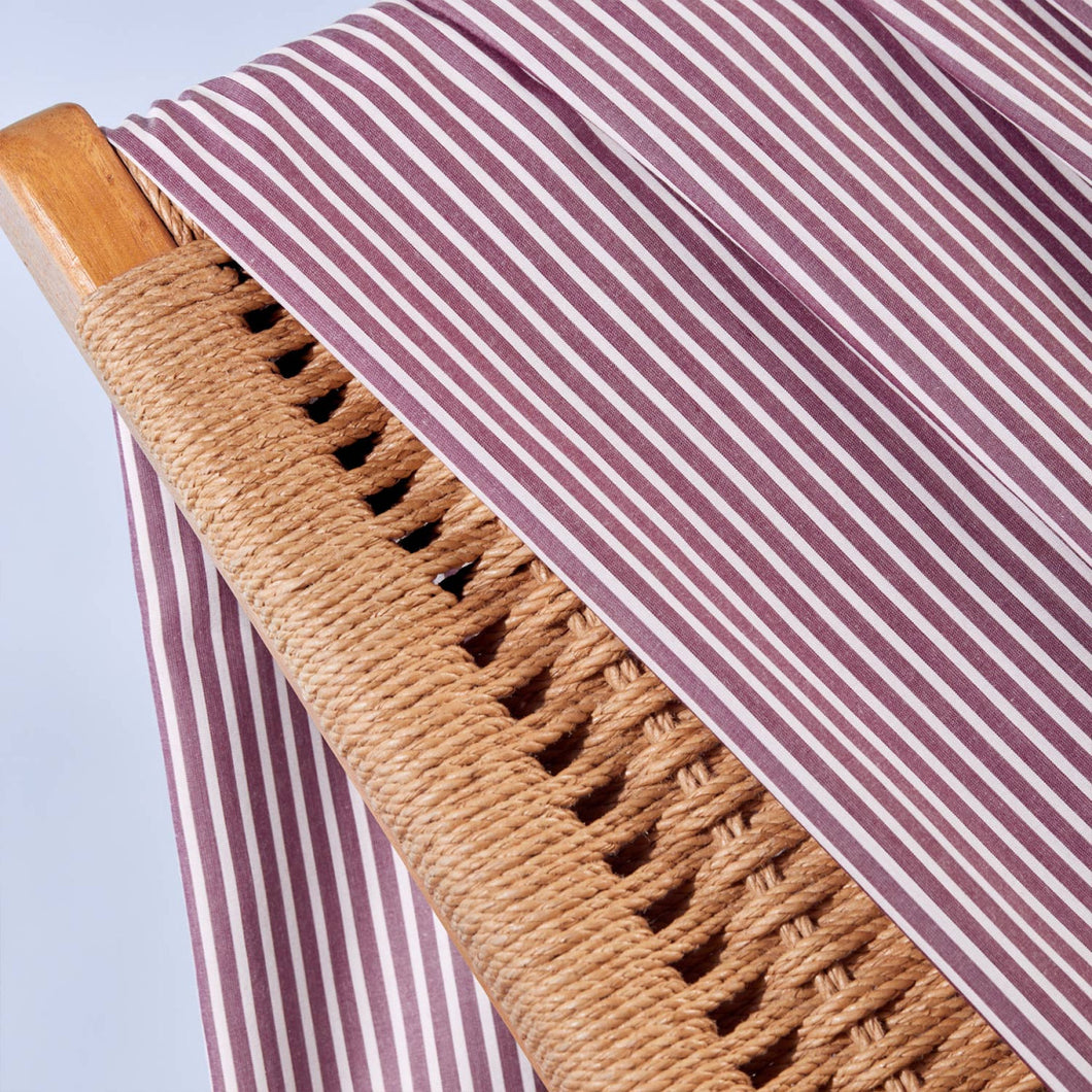Close up of Stripe Sunray Viscose Modal fabric draped over wicker chair