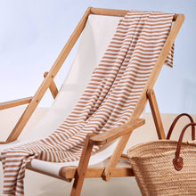 Load image into Gallery viewer, Sunray Stripe Viscose Modal fabric draped over deckchair
