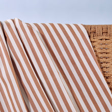 Load image into Gallery viewer, Close up of Sunray Stripe Viscose Modal fabric draped over wicker chair
