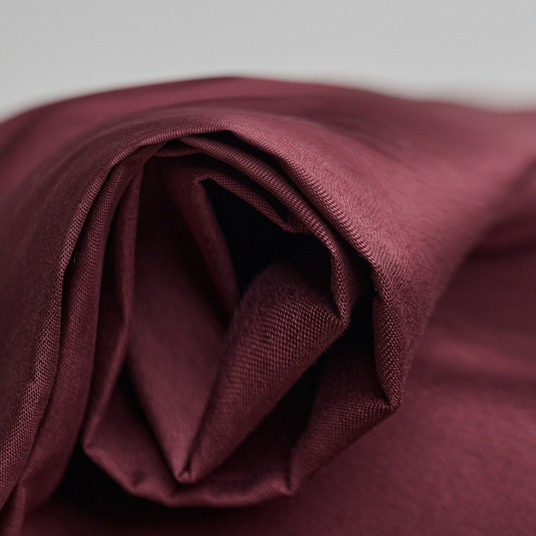 Close up of folded end, roll of Oxford Cotton fabric